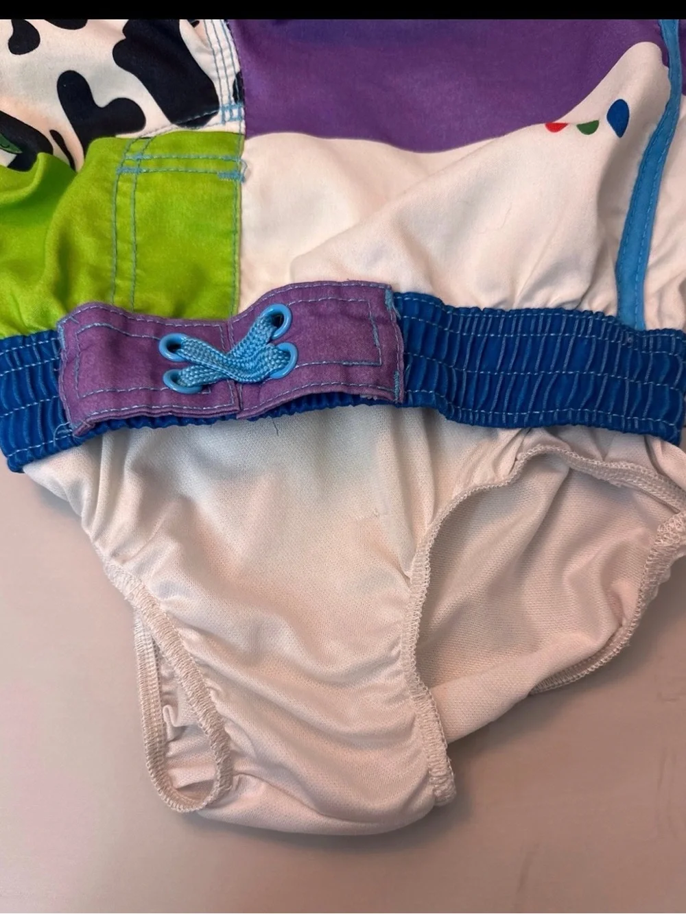 Disney Toy Story Patchwork Swim Shorts in Blue, Green & Purple